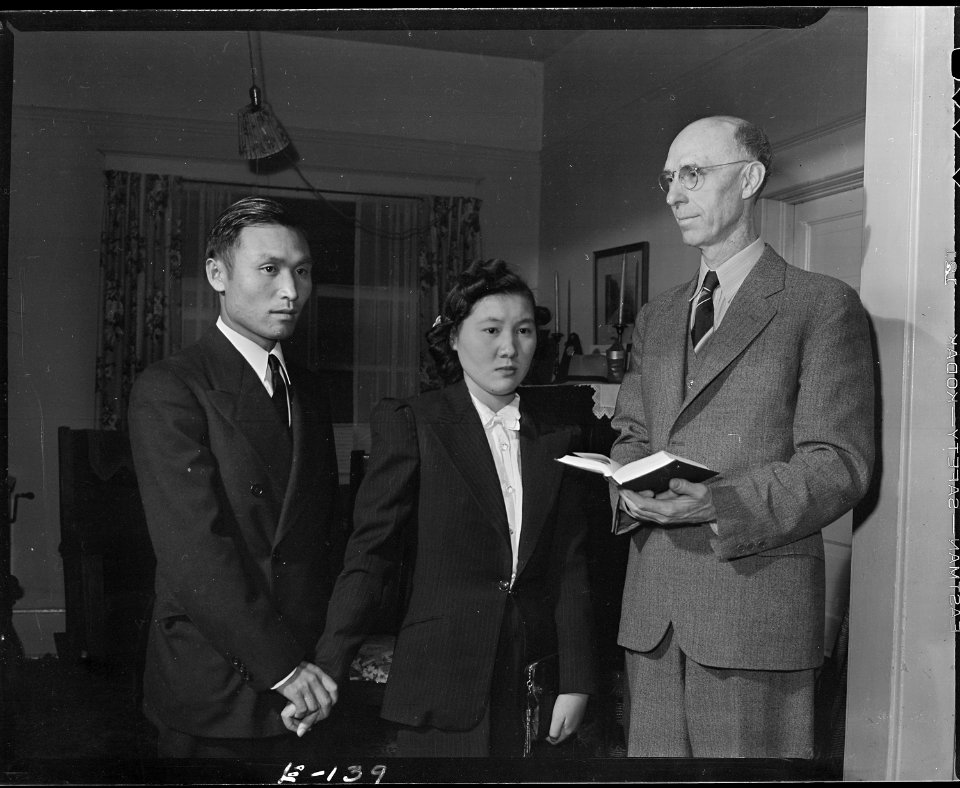 Heart Mountain Relocation Center, Heart Mountain, Wyoming. Reverend Clyde Keegan performs a wedding . . . - NARA - 538795