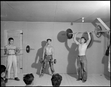 Heart Mountain Relocation Center, Heart Mountain, Wyoming. The instructor and two students demonstr . . . - NARA - 538756 photo