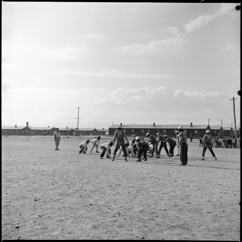 Heart Mountain Relocation Center, Heart Mountain, Wyoming. Scene on a football field during a praci . . . - NARA - 539477