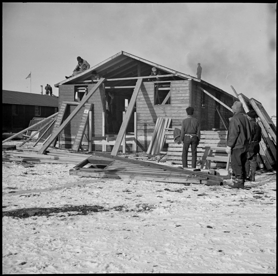 Heart Mountain Relocation Center, Heart Mountain, Wyoming. Workmen reconstructing an abandoned Civi . . . - NARA - 539207