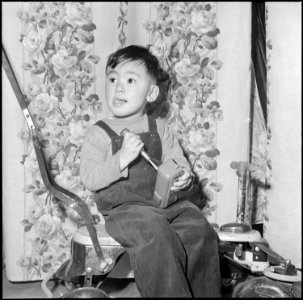 Heart Mountain Relocation Center, Heart Mountain, Wyoming. Young Mike Hosokawa's chief interest are . . . - NARA - 539163
