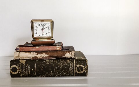 Time old books white background photo