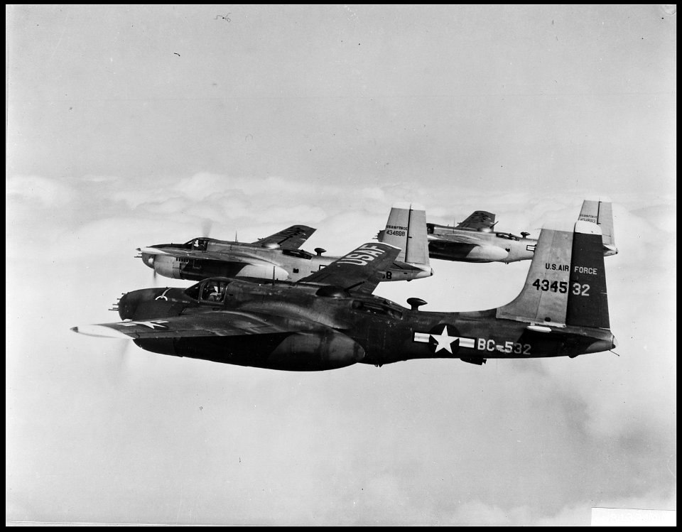 Homeward Bound-A tight formation of B-26 Invader light bombers of the Fifth Air Force's 452nd Bomb Wing (light) do... - NARA - 542239 photo