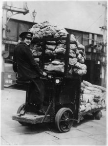 Historical. Women's work, railway workers. Railsdok Parcel Truck workers. Operating railway parcel transfer. Girl... - NARA - 522866 photo