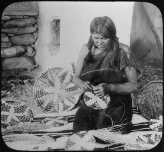 Hopi woman weaving a basket, ca. 1900 - NARA - 520083 photo