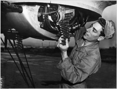 HQ., 20TH AIR FORCE, OKINAWA - As take-off time approaches, Airman Joseph Migliardi, 274 King St., Port Chester... - NARA - 542360