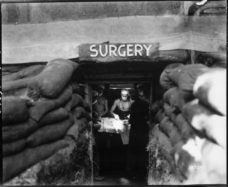 In an underground surgery room, behind the front lines on Bougainville, an American Army doctor operates on a U.S.... - NARA - 531177