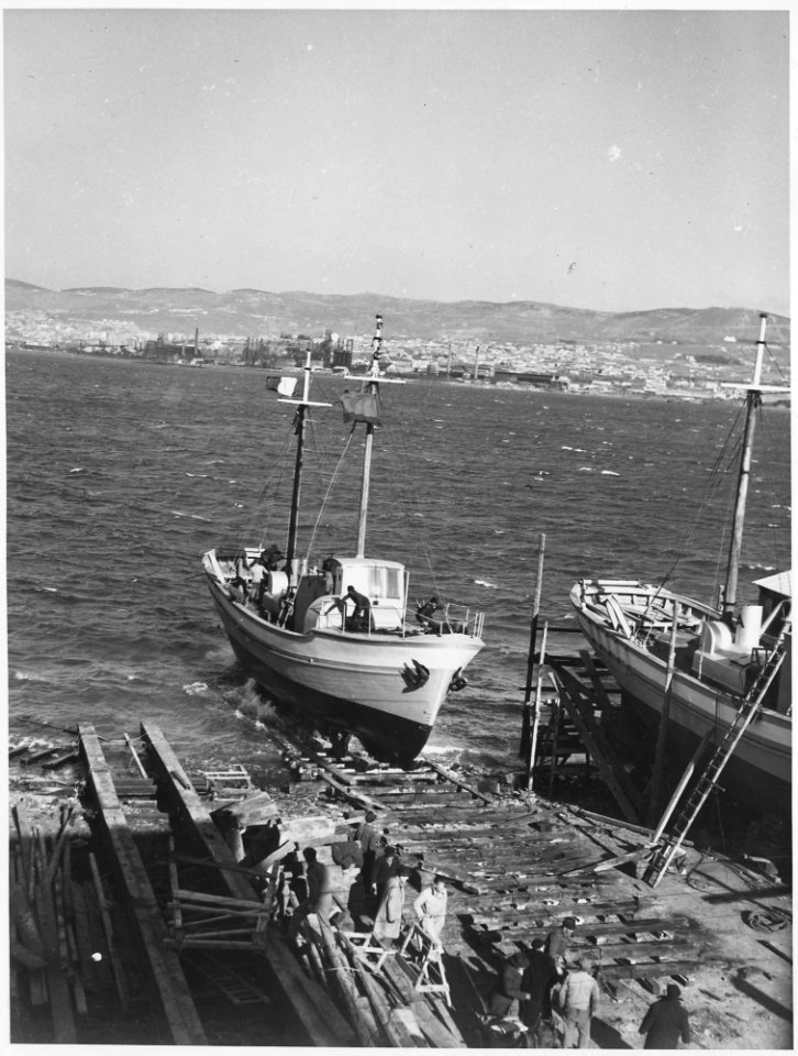 Italy. Here one of the ships of the Lampedusa flotilla, built with European Recovery Program aid, is launched at a... - NARA - 541725