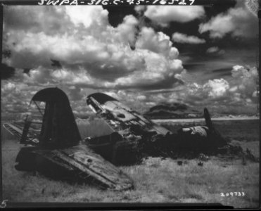 Infra red view of wrecked Japanese plane near Angeles, Pampanga, on Luzon, Philippine Islands In the background is... - NARA - 531307