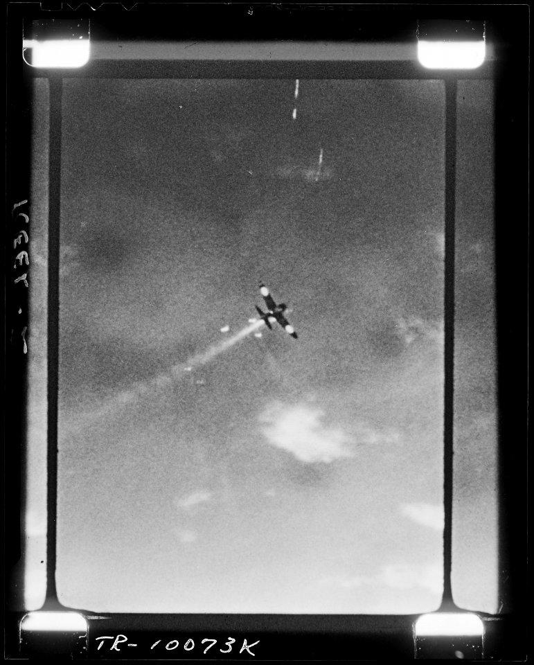 Japanese Zeke (type O.MK.IF) leaves flaming trail over Palau. - NARA - 520982