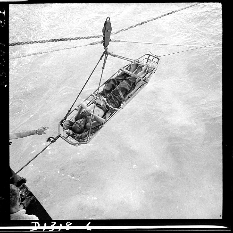 Japanese prisoner being transferred to the USS Hornet (CV-12) after Navy planes had shot down the plane that was... - NARA - 520864