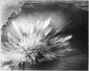 Japanese attack on the USS ENTERPRISE, afternoon of 24 August 1942. Third Japanese bomb hit on the flight deck of the... - NARA - 520592 photo