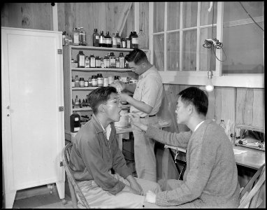 Jerome Relocation Center, Denson, Arkansas. A patient, teacher of high school science, being examin . . . - NARA - 538864