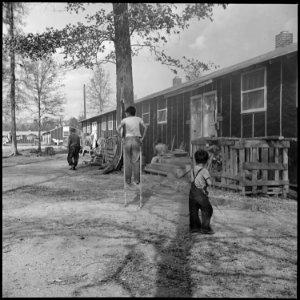 Jerome Relocation Center, Denson, Arkansas. A street scene in block 7 on a November afternoon. - NARA - 538833