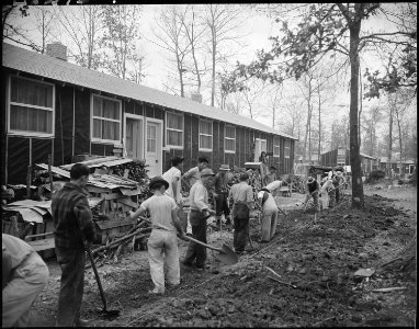 Jerome Relocation Center, Denson, Arkansas. A typical scene, showing a crew of men preparing draina . . . - NARA - 538868