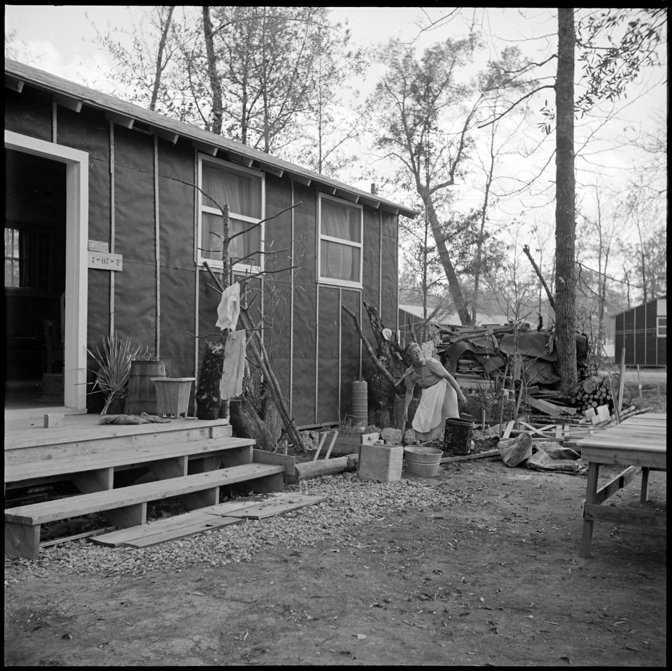 Jerome Relocation Center, Denson, Arkansas. Mrs. T. Arima busily prepares her doorstep garden in Bl . . . - NARA - 538836