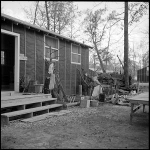 Jerome Relocation Center, Denson, Arkansas. Mrs. T. Arima busily prepares her doorstep garden in Bl . . . - NARA - 538836