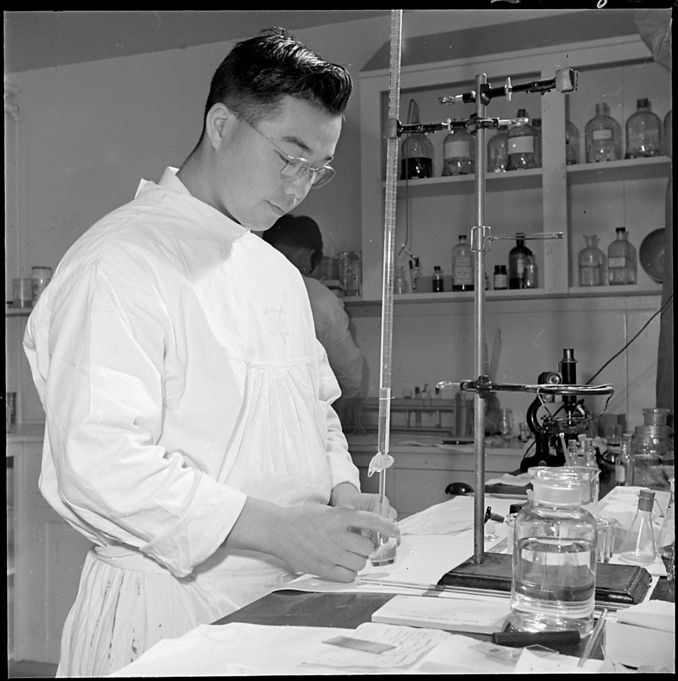 Jerome Relocation Center, Denson, Arkansas. Tom Arase, former California Bio-Chemistry student, per . . . - NARA - 539317