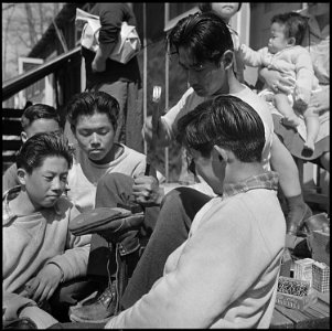 Jerome Relocation Center, Denson, Arkansas. On a sunny afternoon, the center resident who can repai . . . - NARA - 539336