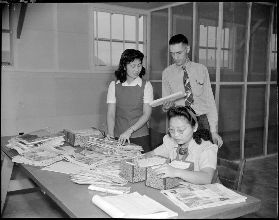 Jerome Relocation Center, Denson, Arkansas. Two assistant postal clerks sorting mail and readdressi . . . - NARA - 538861
