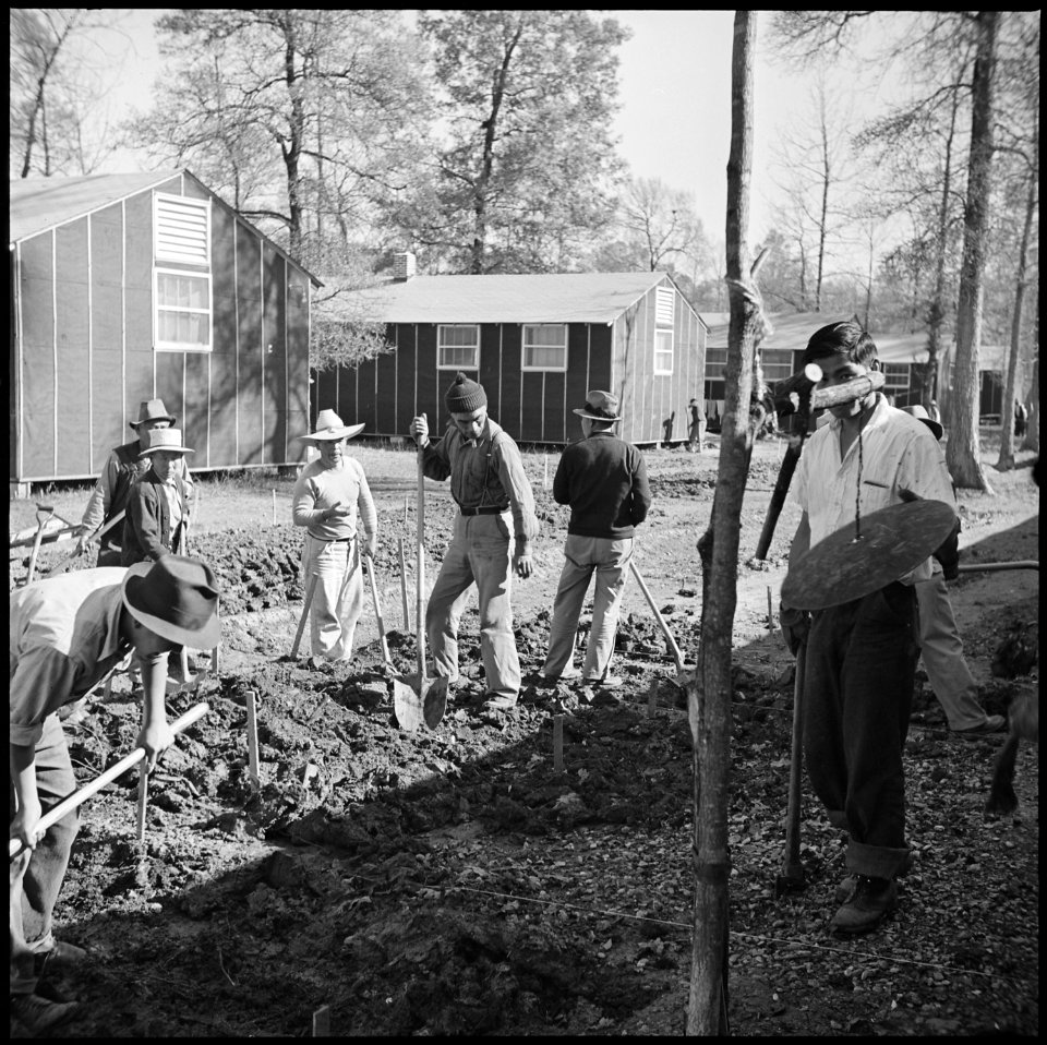 Jerome Relocation Center, Denson, Arkansas. Workers preparing drainage ditches in front of Block 7 . . . - NARA - 538838