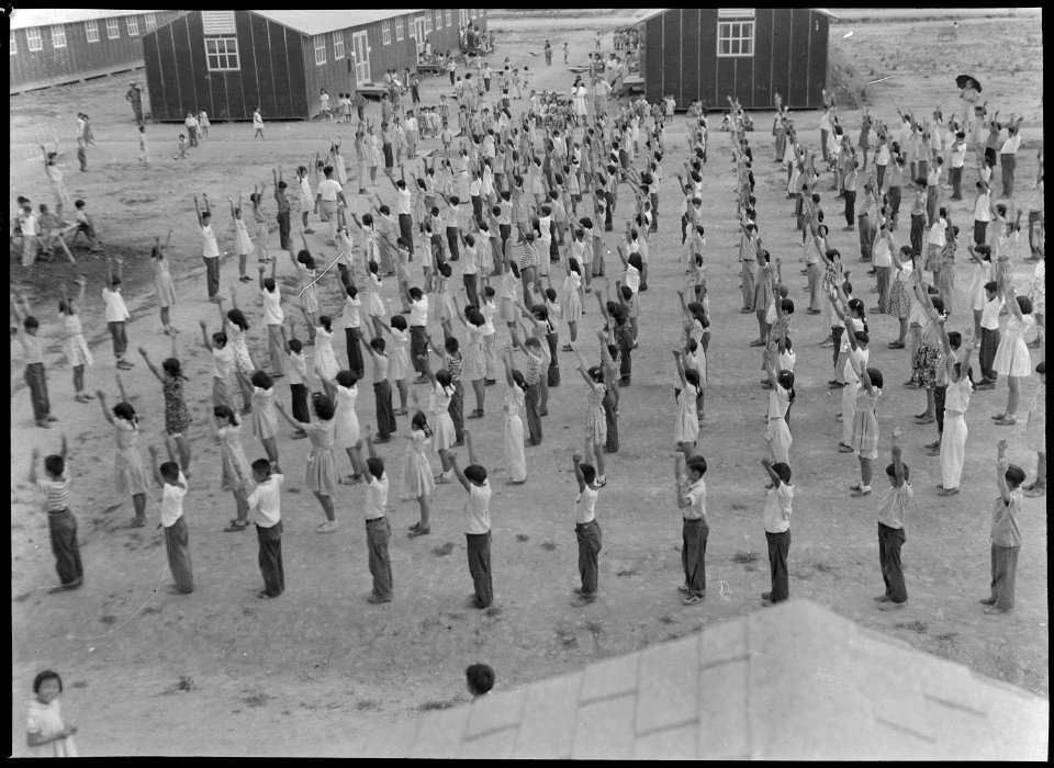 Jerome Relocation Center, Dermott, Arkansas. View of 5th and 6th graders going through their exerci . . . - NARA - 537310