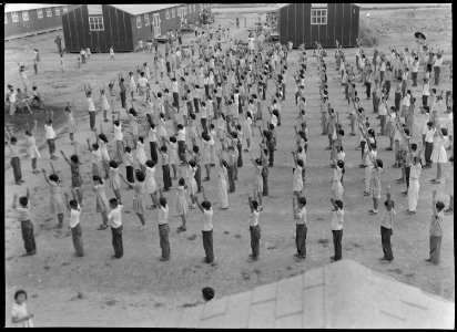 Jerome Relocation Center, Dermott, Arkansas. View of 5th and 6th graders going through their exerci . . . - NARA - 537310
