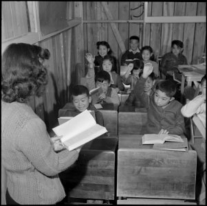Jerome Relocation Center, Denson, Arkansas. While a portion of her grade class studies, another sec . . . - NARA - 539331