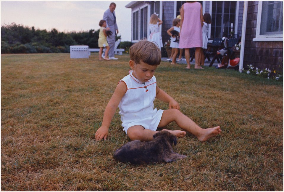 John F. Kennedy Jr. with puppy. Hyannisport, MA, Squaw Island - NARA - 194256