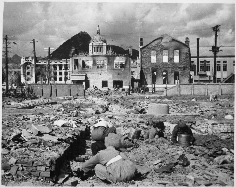 Korean women and children search the rubble of Seoul for anything that can be used or burned as fuel. - NARA - 531386