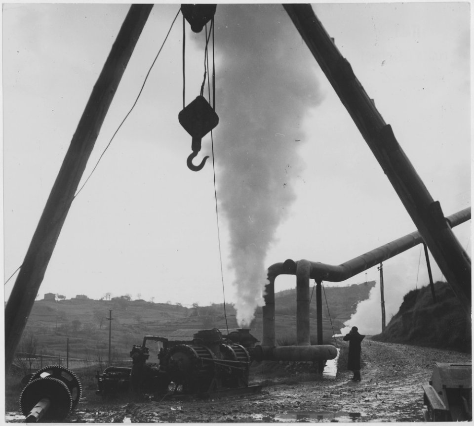 Larderello, Italy. Picture shows a steam geyser which has been opened at the mouth of the well in order to repair... - NARA - 541745