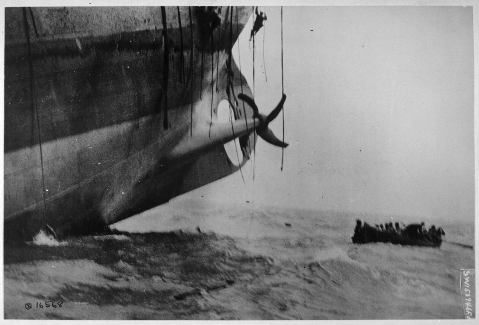 Last minute escape from vessel torpedoed by German sub. The vessel has already sunk its bow into the waves, and her... - NARA - 530735