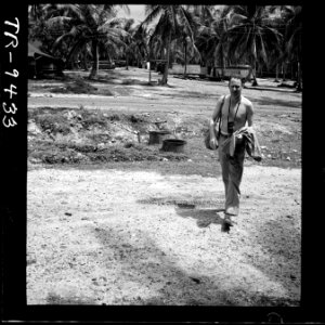 Lcdr. Horace Bristol, one of Capt. Steichen's ace photographers, goes to work, photographically recording the war... - NARA - 520841