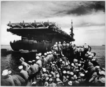 Liberty party. Liberty section personnel aboard a mechanized landing craft returning to USS CASABLANCA from Rara... - NARA - 520580