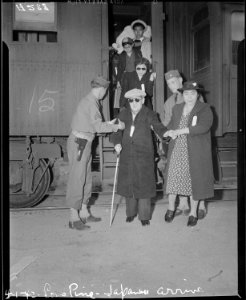 Lone Pine, California. Evacuees of Japanese ancestry arrive here by train and await buses for Manza . . . - NARA - 536229