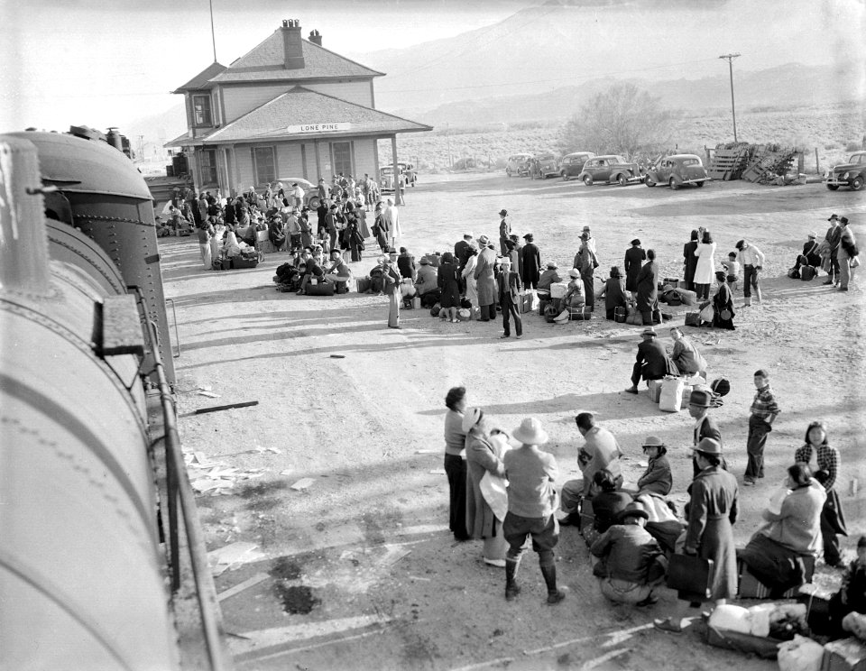 Lone Oine, California. Evacuees of Japanese ancestry waiting to board buses which will take them to . . . - NARA - 536011