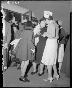 Lone Pine, California. Evacuees of Japanese ancestry arrive here by train and await buses for Manza . . . - NARA - 536228