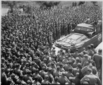 Lieutenant Colonel Woran, Chaplain of the 10th Mountain Division, leads a group of men in prayer at Torboli the day... - NARA - 531282