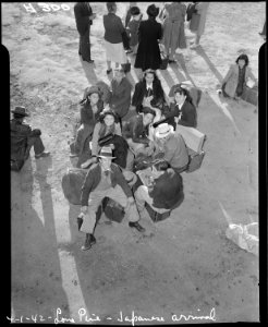 Lone Pine, California. Evacuees of Japanese ancestry arrive here by train and await buses for Manza . . . - NARA - 536239