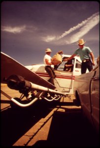 LOADING ZINC POISON WHICH WILL BE SPREAD BY PLANE OVER ACTIVE SQUIRREL COLONIES - PART OF FRESNO - NARA - 542578