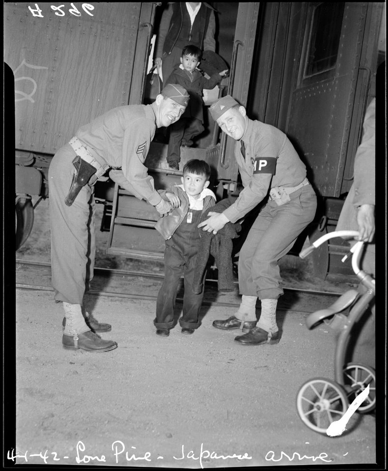 Lone Pine, California. Young evacuees of Japanese ancestry arrive here by train prior to being tran . . . - NARA - 536235