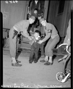 Lone Pine, California. Young evacuees of Japanese ancestry arrive here by train prior to being tran . . . - NARA - 536235