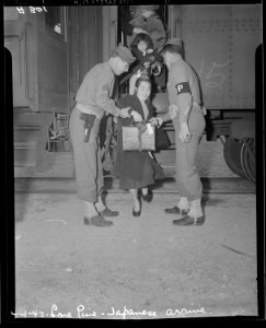 Lone Pine, California. Evacuees of Japanese ancestry arrive here by train and await buses for Manza . . . - NARA - 536240