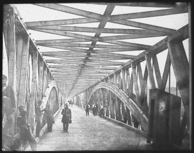 Long Bridge, Lincoln's Time. Washington, DC. Union troops guarding a bridge over the Potomac River to Virginia to preven - NARA - 518223 photo