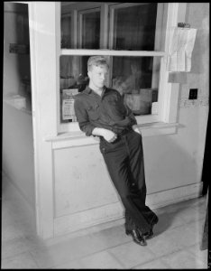 Los Angeles, California. Aircraft Schools. Waiting to be called for aircraft employment from the aircraft school. He... - NARA - 532183 photo