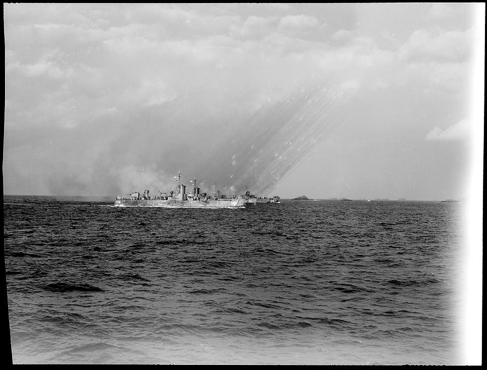 LSM's (R) sending rockets at the shores of Pokishi Shima, near Okinawa, 5 days before invasion. - NARA - 520679
