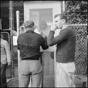 Los Angeles, California. Lockheed Employment. The young man on the right wears an old Texaco gas station uniform. He... - NARA - 532207 photo