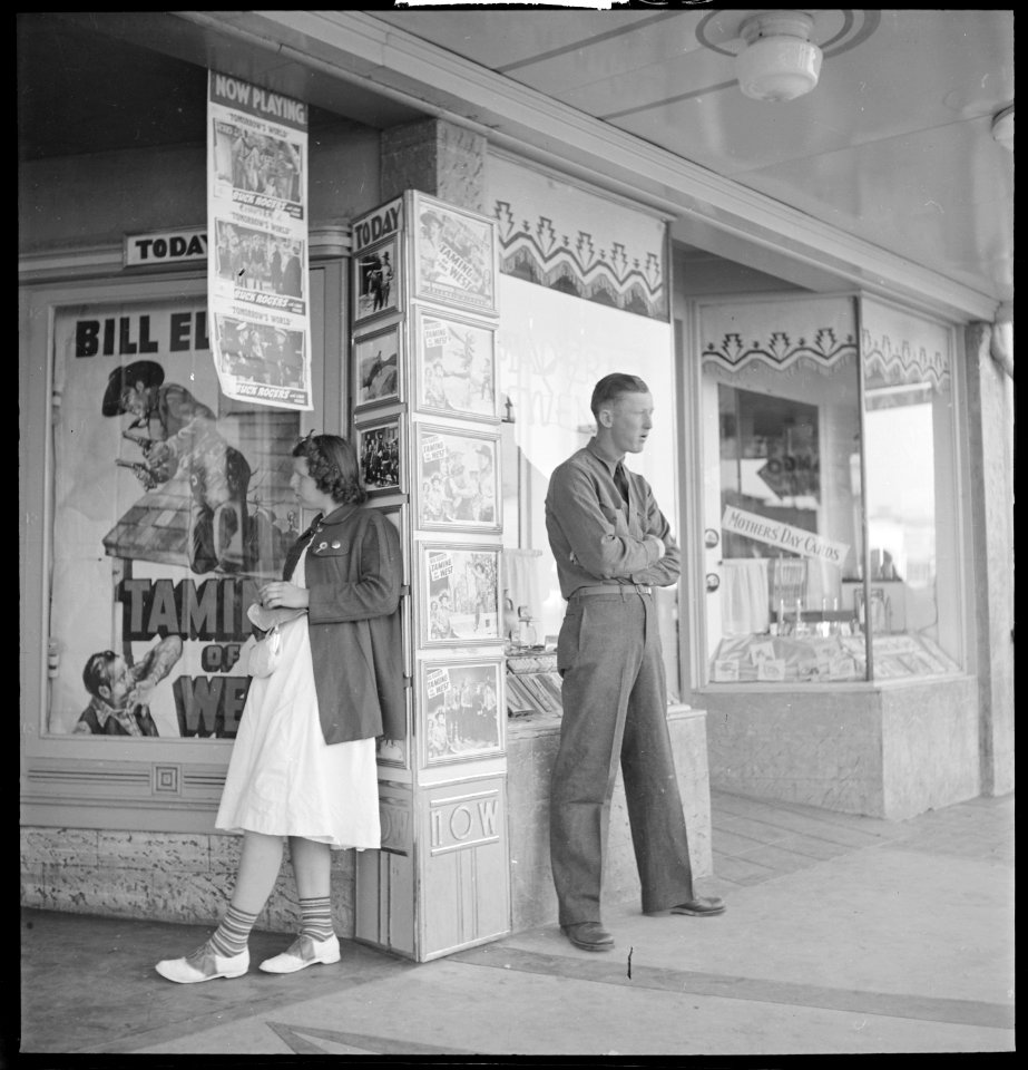 Madera County, California. Hanging Around. Waiting for the movie house to open at 1 p.m. Sunday in the small San... - NARA - 532151