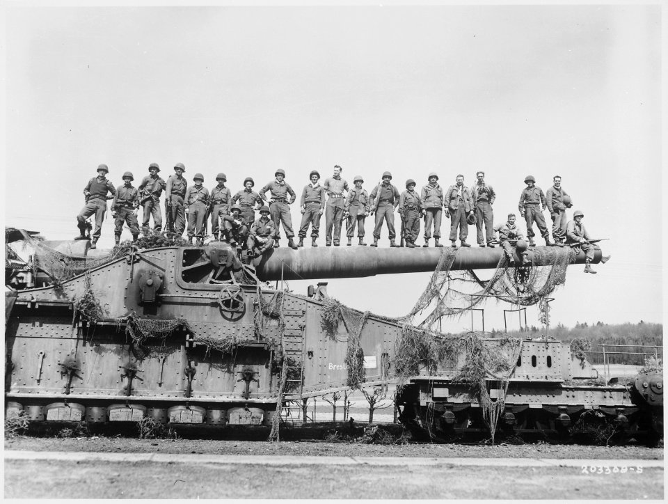 Mammoth 274mm railroad gun captured in the U.S. Seventh Army advance near Rentwertshausen easily holds these 22 men... - NARA - 531256
