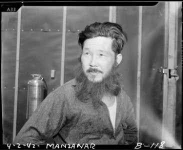 Manzanar Relocation Center, Manzanar, California. A bewhiskered evacuee at this War Relocation Auth . . . - NARA - 536866